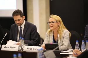 Helen Duffy, the lead consultant for the research and drafting of the publication, speaks at its launch event, held on the sidelines of the 2018 Human Dimension Implementation Meeting, as Omer Fisher, Head of the ODIHR Human Rights Department, listens. Warsaw, 12 September 2018. (OSCE/Maria Kuchma)