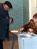 A man receives his ballot to vote in Armenia's presidential election, 19 February 2008. (OSCE/Jens Eschenbaecher)