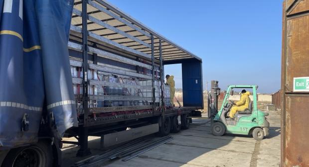 Geocoma employees load chemicals onto a truck, bound for Germany, Floresti, January 2025. (OSCE/Katarzyna Kubiak)