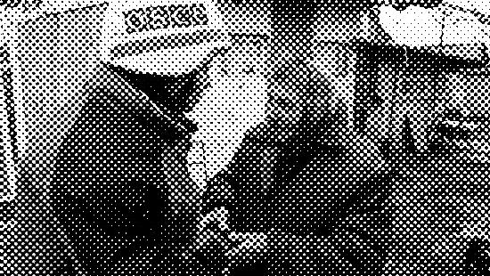 A person in an OSCE jacket interacts warmly with an elderly woman in a rural setting.